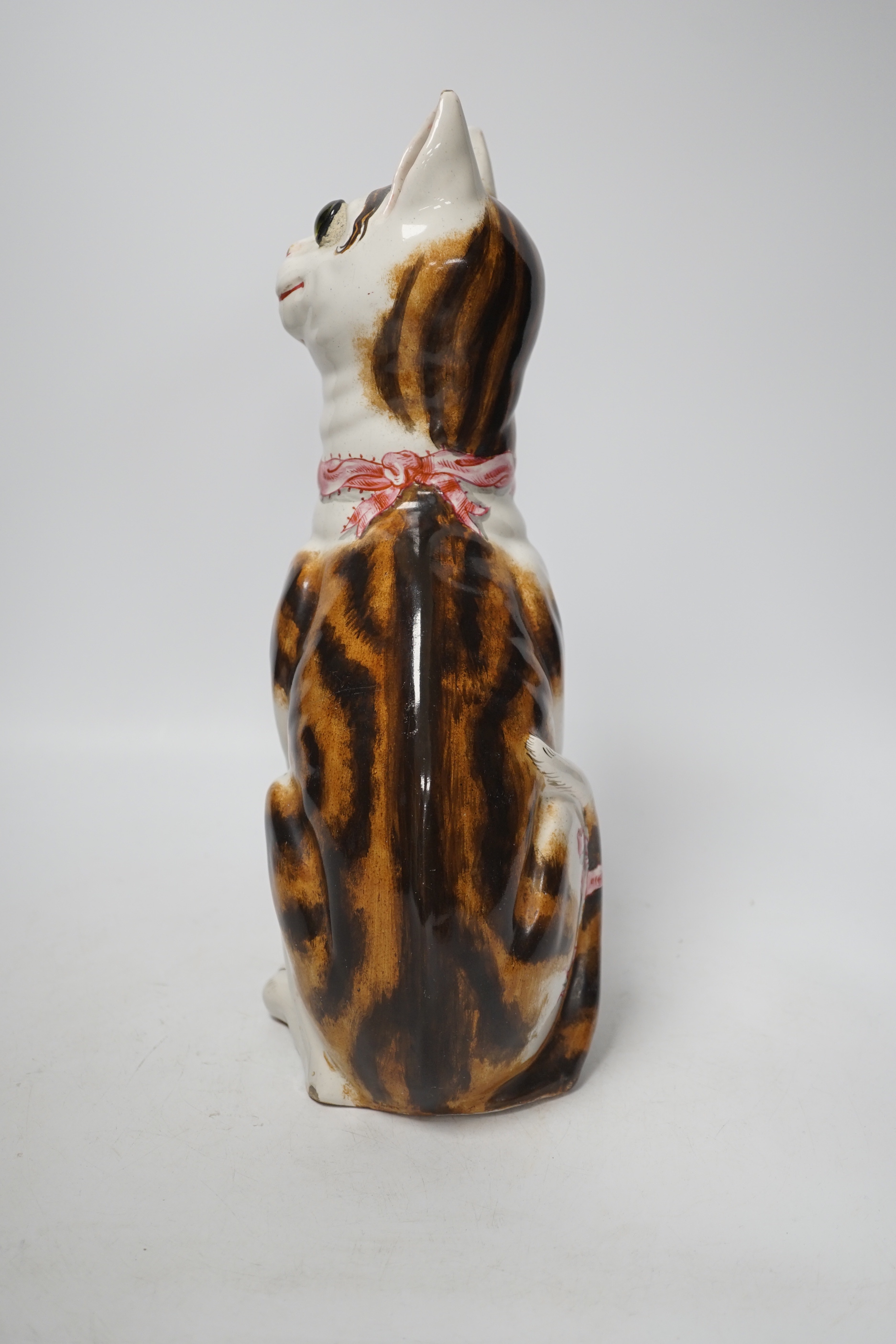 A Gallé faience cat ‘La Signara Colombina’ with glass eyes, signed Gallé Nancy to hind right foot, 32cm high